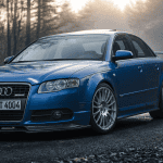 audi a4 dtm edition bleu sprint sur route sinueuse au lever du jour